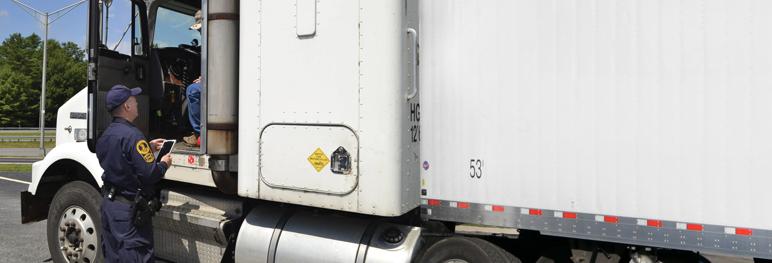 Truck driver talking with a safety officer